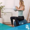 woman doing core-stability exercises on a TheraBall