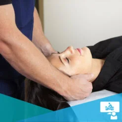 Female patient receiving a neck treatment from a Chiropractor