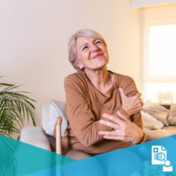 Elderly woman in pain massaging her shoulder