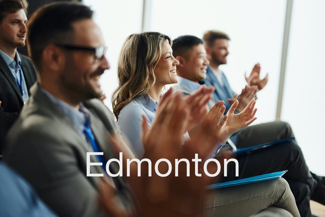 Chiropractors applauding at a continuing education seminar in Edmonton
