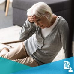 Older woman holding her head after falling on the floor