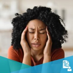 A young black woman with a headache holding her temples with her hands