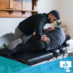 Young male chiropractor adjusting a patient's low back in a side posture position / spinal manipulation