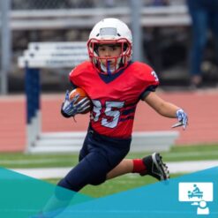 Child holding a football running in full football equipment / concussion